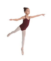 Photo of Little ballerina practicing dance moves on white background