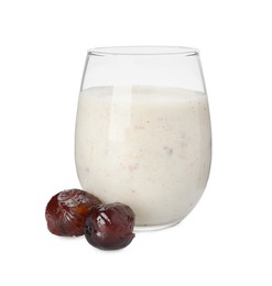 Glass of delicious date smoothie and dried fruits on white background