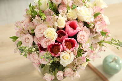 Photo of Beautiful bouquet of fresh flowers on table indoors, closeup