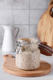 Sourdough starter in glass jar on light table