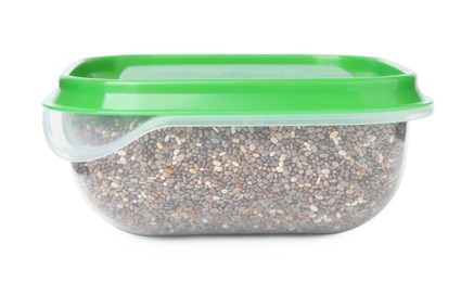 Photo of Plastic container filled with chia seeds isolated on white