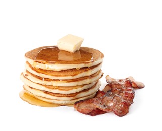 Delicious pancakes with maple syrup and fried bacon on white background