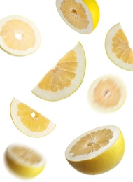 Image of Fresh exotic pomelo fruits falling on white background 