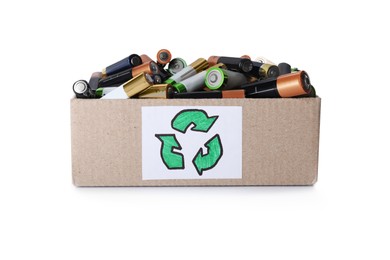 Used electric batteries in cardboard box with recycling symbol on white background