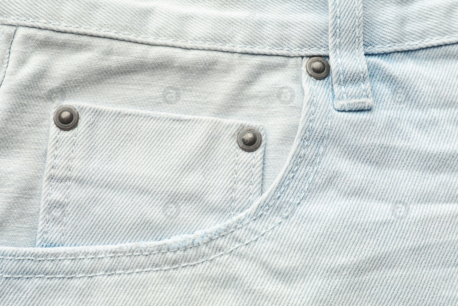 Photo of Closeup view of jeans pocket as background