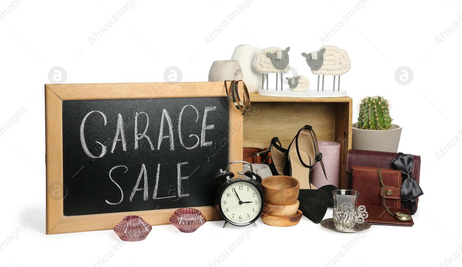 Photo of Blackboard with sign Garage Sale and many different stuff isolated on white