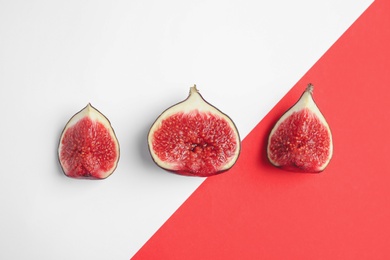 Photo of Delicious ripe figs on color background, flat lay