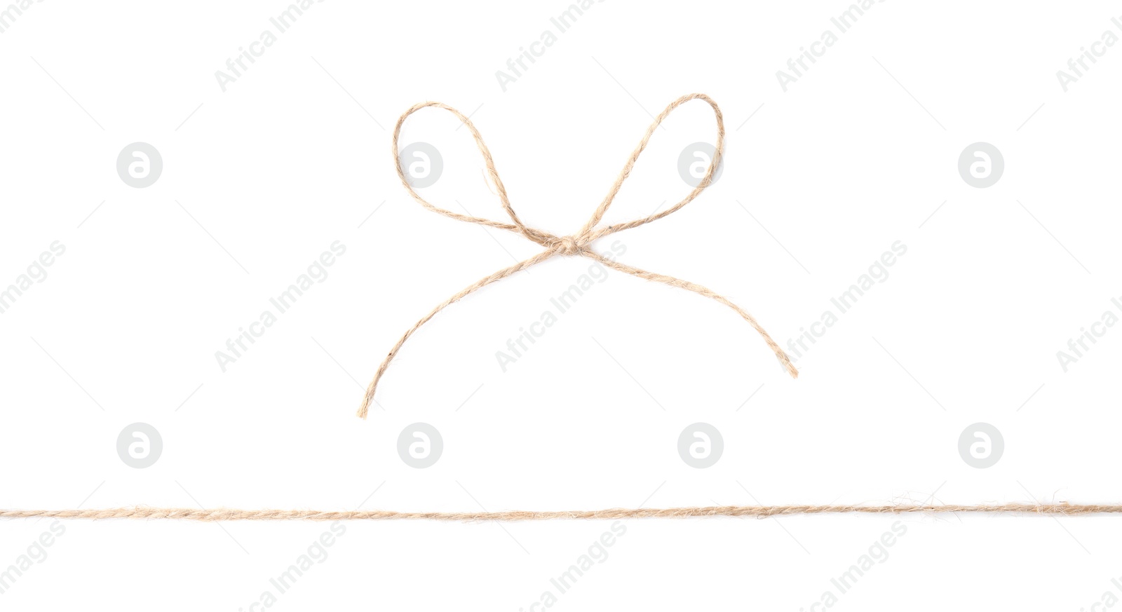 Photo of Linen rope string with bow isolated on white, top view