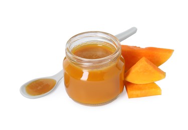 Photo of Tasty baby food in jar, spoon and fresh pumpkin isolated on white