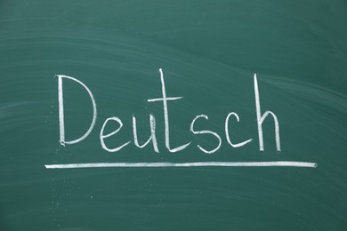Photo of Word Deutsch written with chalk on green board