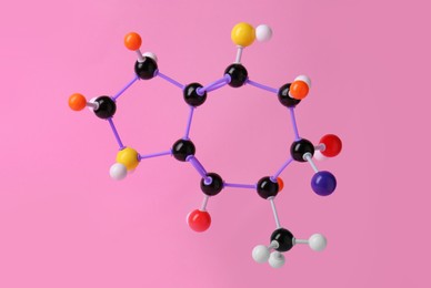 Photo of Structure of molecule on pink background. Chemical model