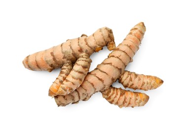 Photo of Fresh whole turmeric roots isolated on white, top view