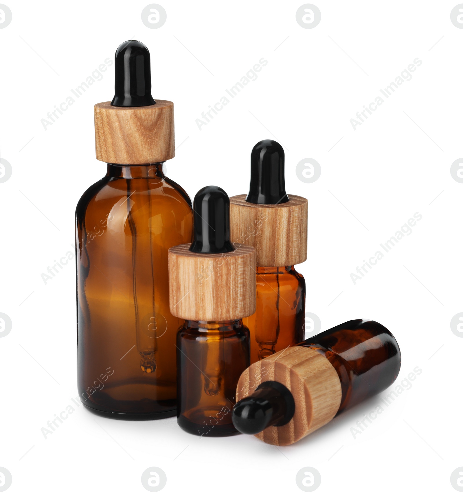 Photo of New empty glass bottles with droppers isolated on white