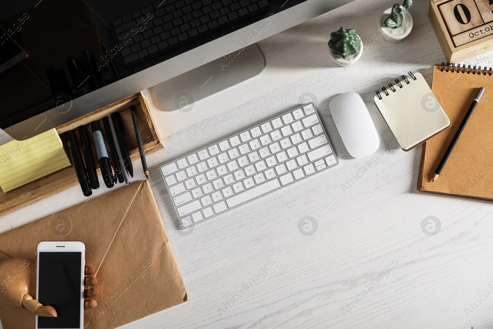 Photo of Designer's workplace with modern computer and stationery, flat lay. Space for text