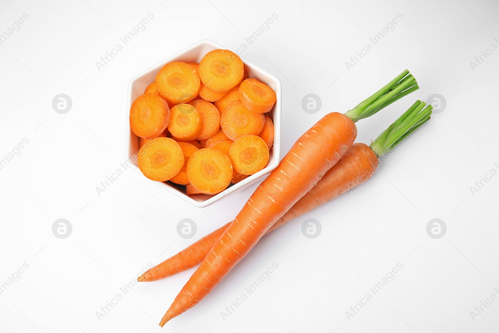 Photo of Ripe fresh carrots on white background