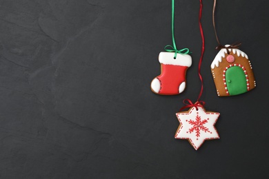 Photo of Different delicious Christmas cookies on black table, flat lay. Space for text