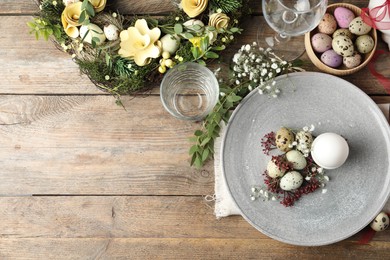 Festive Easter table setting with beautiful floral decor, flat lay. Space for text