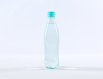 Photo of Plastic bottle of pure water isolated on white