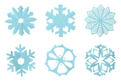 Image of Set of beautiful paper snowflakes on white background