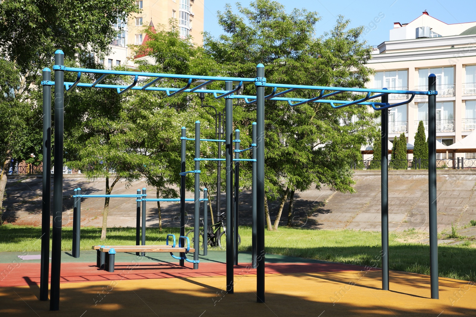 Photo of Empty outdoor gym with exercise equipment in park