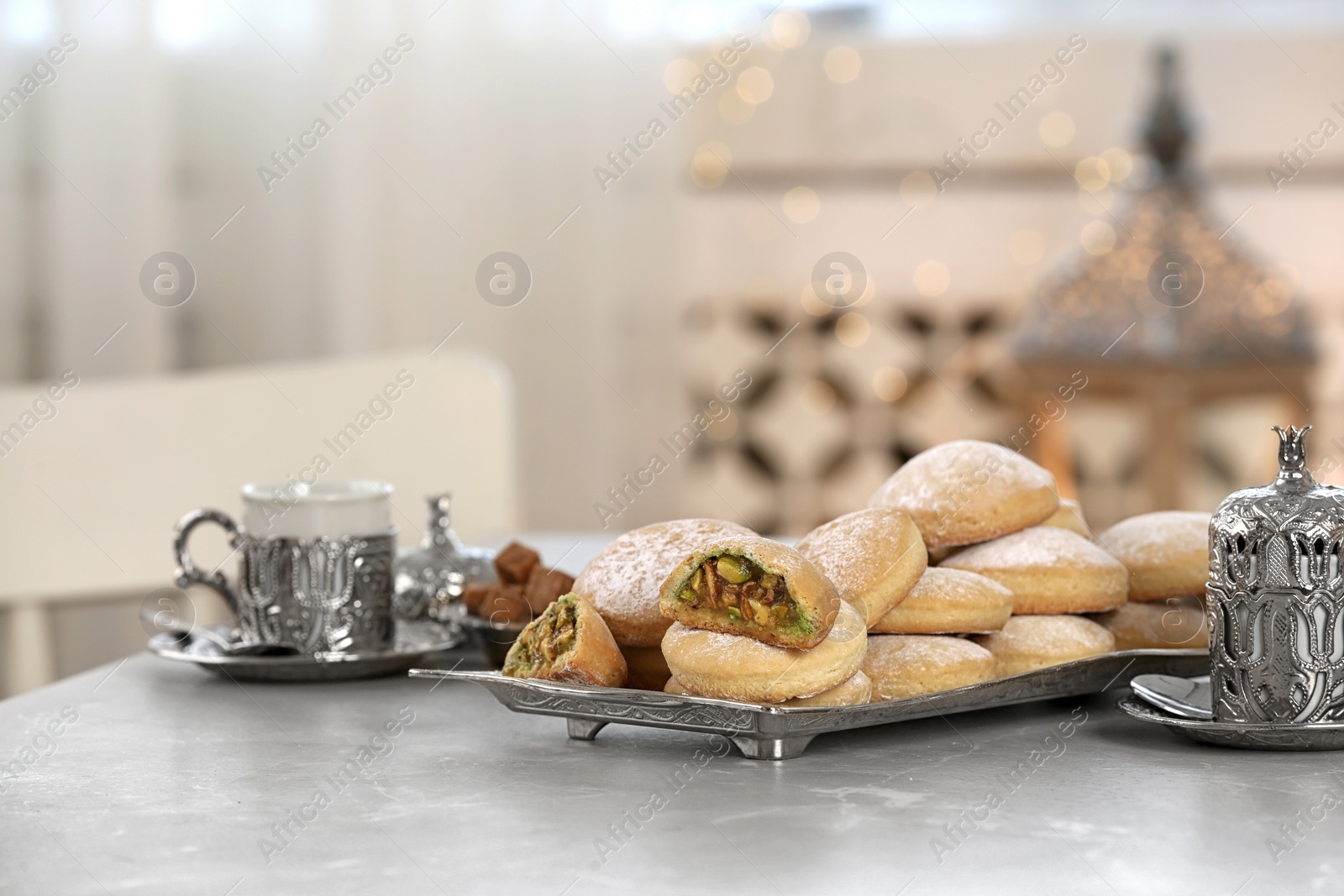 Photo of Traditional Islamic cookies on table, space for text. Eid Mubarak