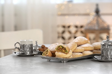 Photo of Traditional Islamic cookies on table, space for text. Eid Mubarak