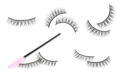 Image of Set with beautiful false eyelashes and brush on white background