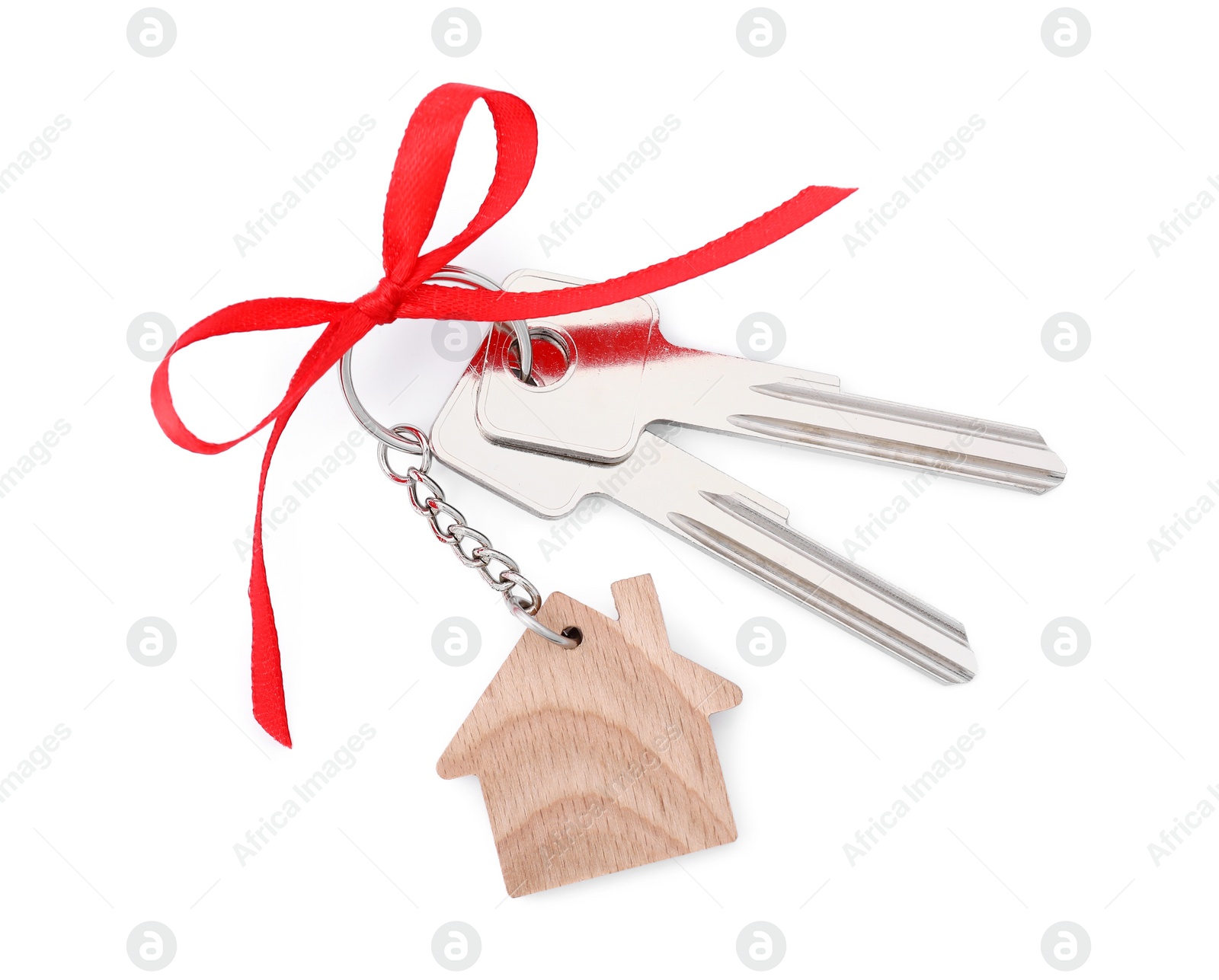 Photo of Keys with keychain in shape of house and red bow isolated on white, above view