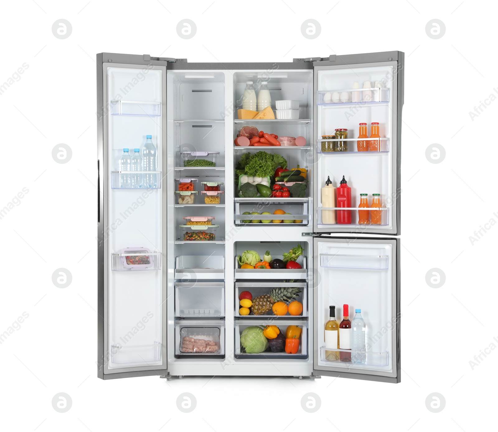 Photo of Open refrigerator full of products isolated on white