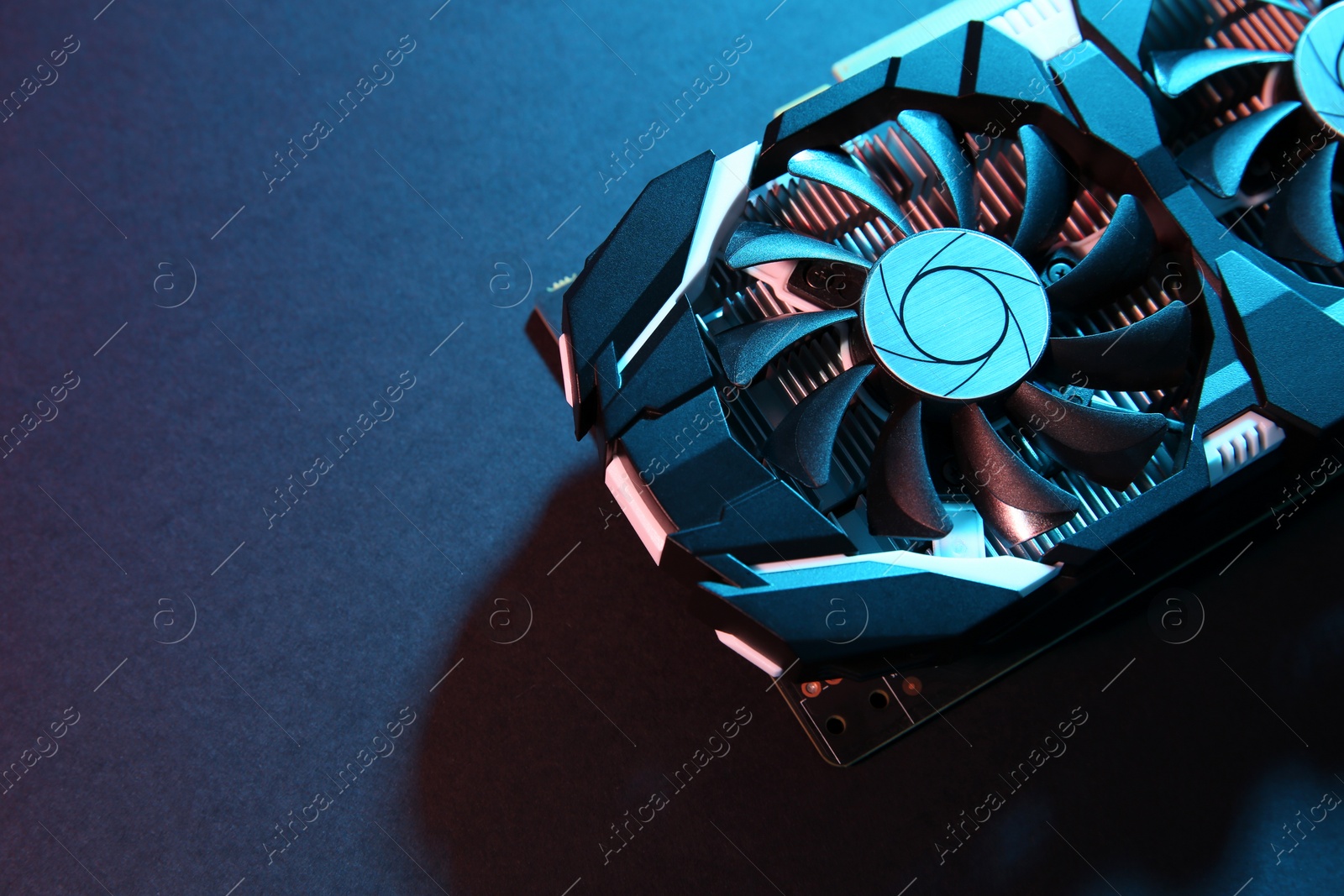 Photo of Computer graphics card on color background, top view. Space for text