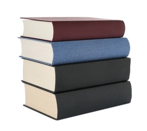 Photo of Many different books stacked on white background