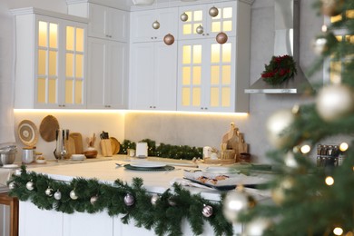 Cozy spacious kitchen decorated for Christmas. Interior design