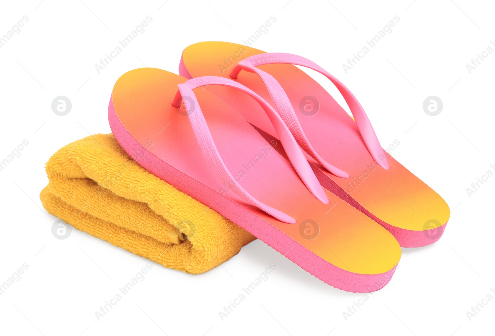Photo of Yellow terry towel and flip flops isolated on white. Beach objects