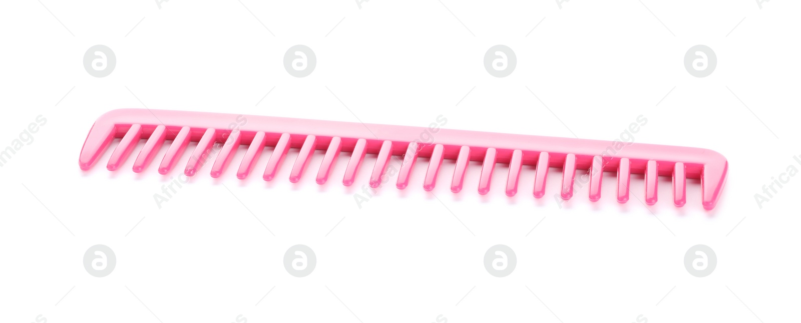 Photo of New pink hair comb isolated on white