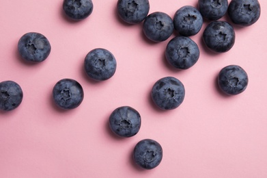 Flat lay composition with tasty blueberry on color background