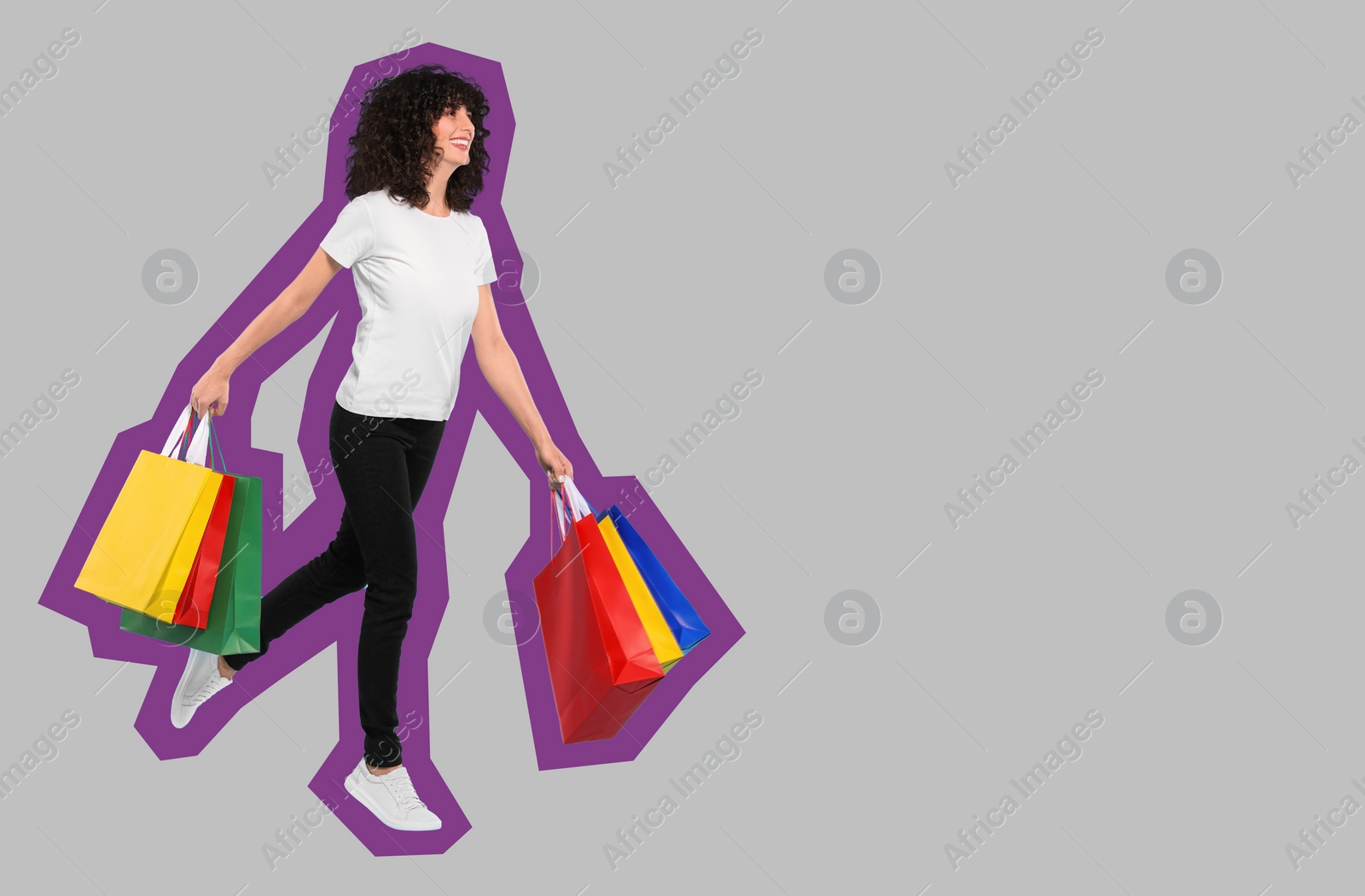 Image of Happy woman with shopping bags on grey background, space for text