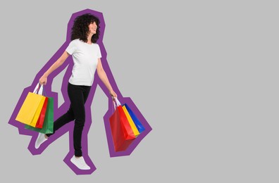 Image of Happy woman with shopping bags on grey background, space for text