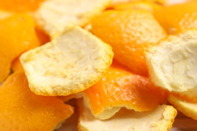Photo of Many orange peels preparing for drying on table, closeup view