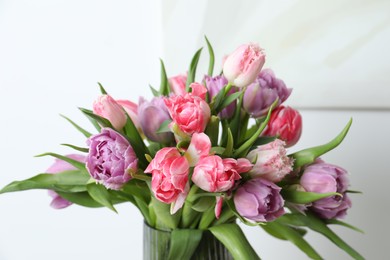 Photo of Beautiful bouquet of colorful tulip flowers on blurred background, closeup