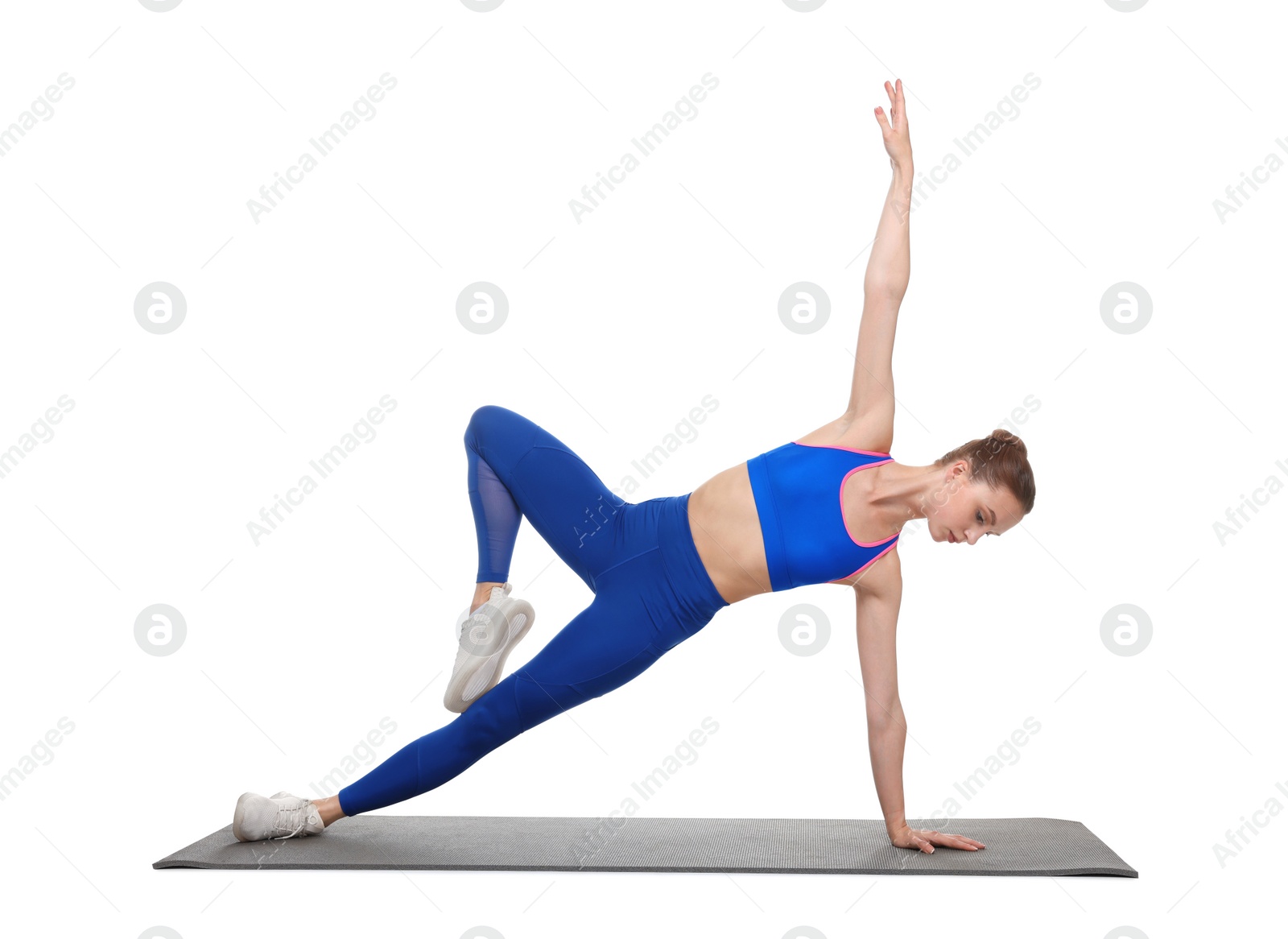 Photo of Young woman practicing yoga on white background