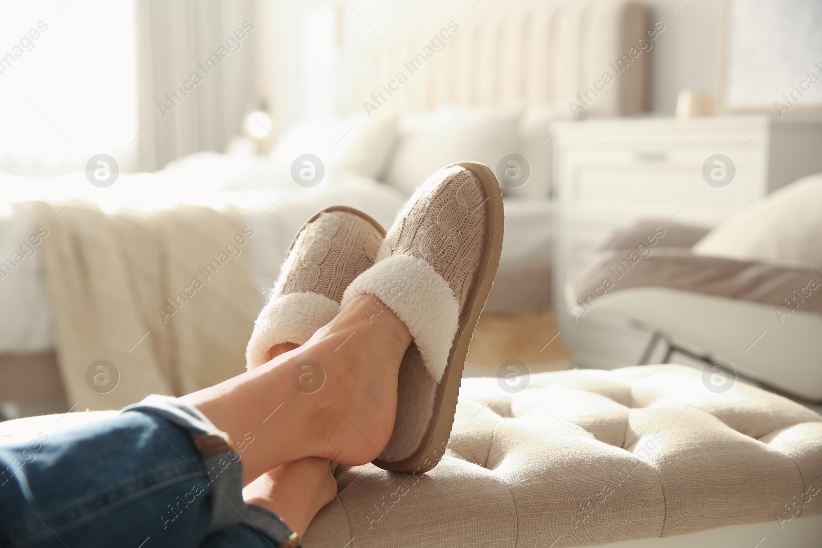 Photo of Woman wearing soft comfortable slippers at home, closeup