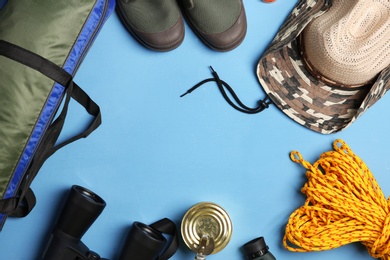 Photo of Flat lay composition with camping equipment on color background