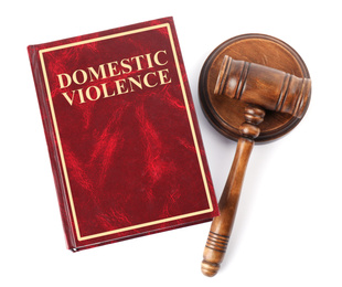 Photo of Domestic violence book and wooden gavel on white background, top view