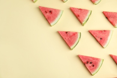 Photo of Slices of ripe watermelon on beige background, flat lay. Space for text