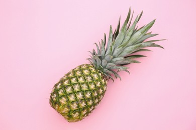 Photo of Delicious ripe pineapple on pink background, top view