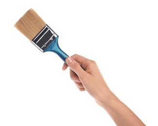Photo of Woman holding paint brush on white background, closeup