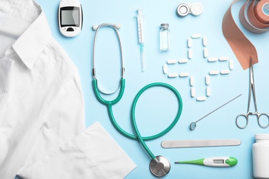 Photo of Flat lay composition with medical objects on color background