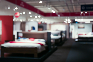 Photo of Blurred view of furniture store in mall. Bokeh effect