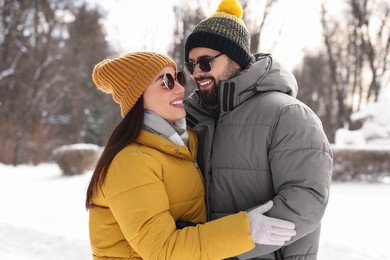 Photo of Beautiful happy couple spending time together on winter day