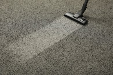 Photo of Vacuuming grey carpet. Clean area after using device. Space for text